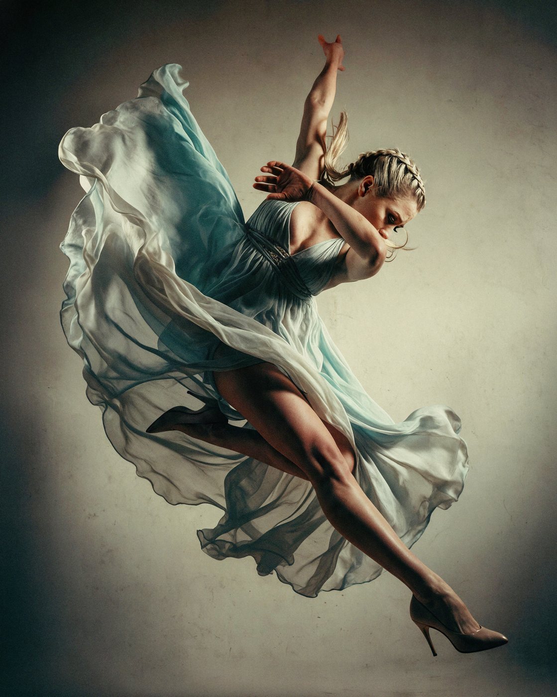 October Second — a dancer mid-leap in a flowing blue-grey dress, one of the spreads inside Receipts